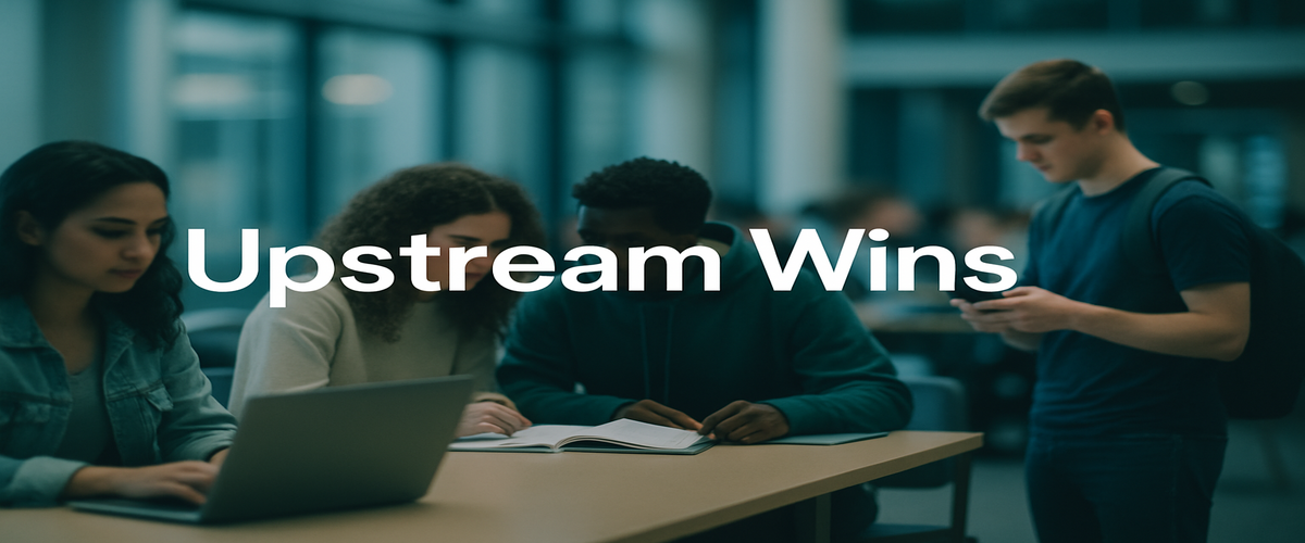 Image of the headline 'Upstream Wins' over a university study area with students collaborating on laptops and phones.